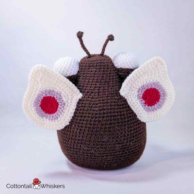 Butterfly crochet doorstop pattern with amigurumi baby caterpillar by cottontail and whiskers