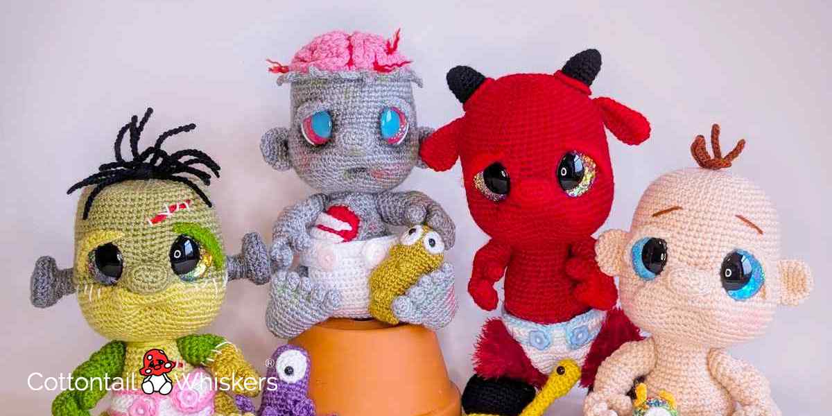 4 cheeky frankenstein, zombie, devil and cute halloween babies in crocheted yarn, created from an original design by Cottontail & Whiskers.