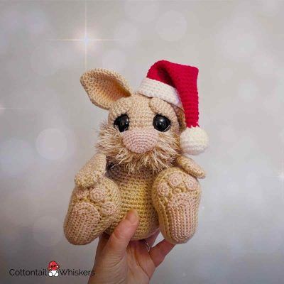 Rabbit with a wee free christmas crochet santa hat pattern by cottontail and whiskers